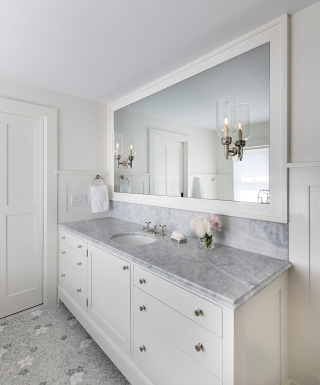 23 University Lane Manchester, MA 01944 - Photo 27 of 40 a bathroom with a granite countertop sink and a mirror