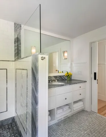 a bedroom with three beds and a window