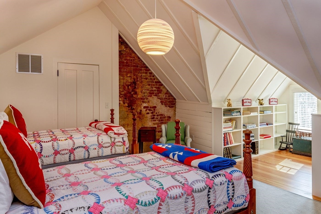 23 University Lane Manchester, MA 01944 - Photo 33 of 40 a bedroom with three beds and a window