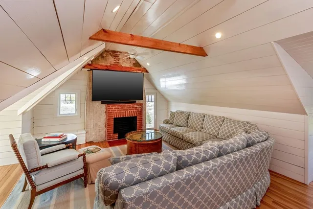 an aerial view of a house with yard swimming pool and outdoor seating
