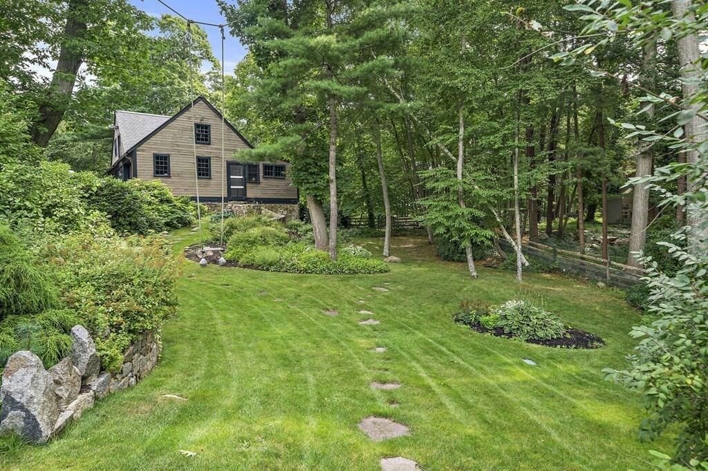23 University Lane Manchester, MA 01944 - Photo 37 of 40 a house view with a garden space