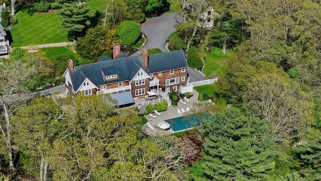 an aerial view of a houses with outdoor space