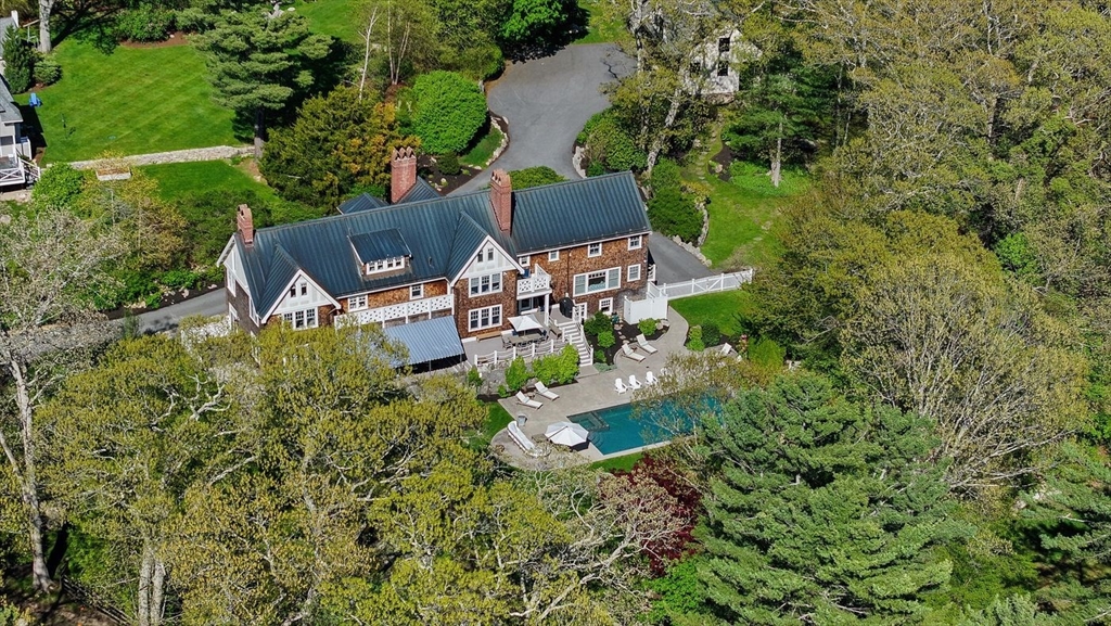 23 University Lane Manchester, MA 01944 - Photo 38 of 40 an aerial view of a house with yard swimming pool and outdoor seating