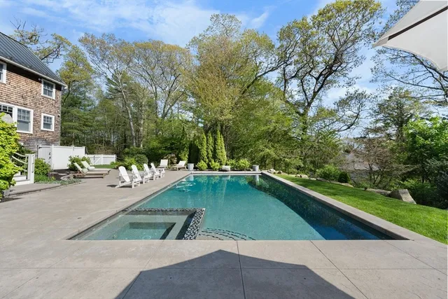 a view of a swimming pool with a lounge chairs