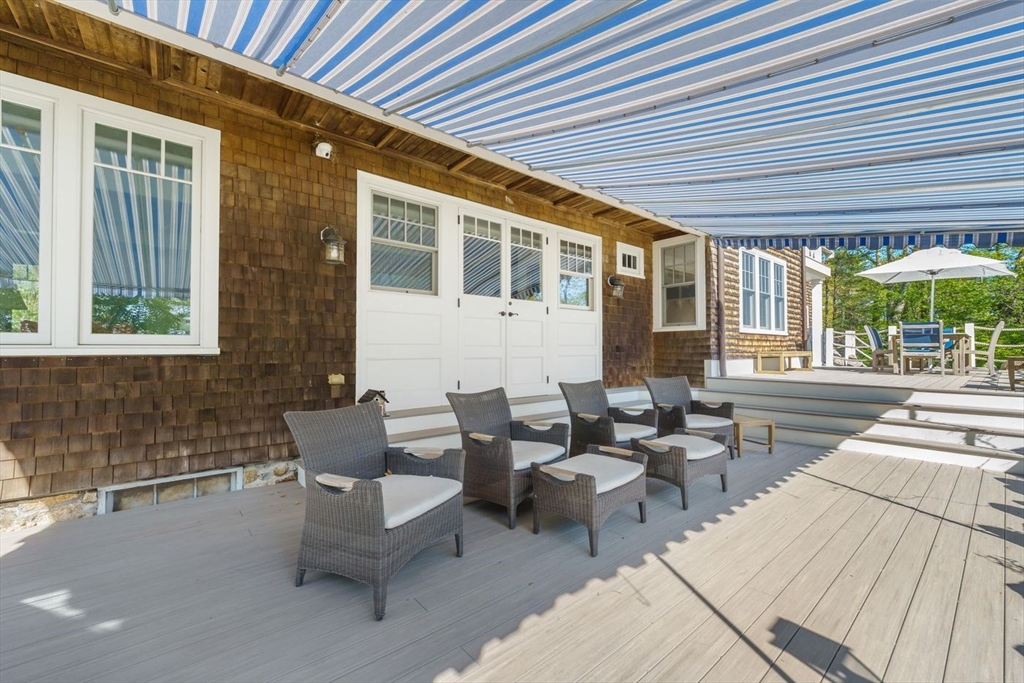 23 University Lane Manchester, MA 01944 - Photo 6 of 40 a outdoor space with patio furniture
