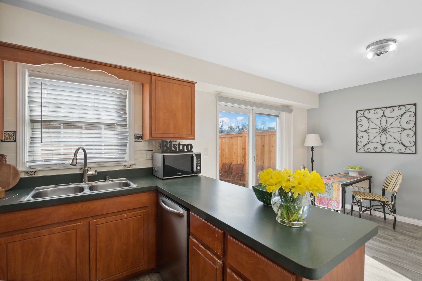 2148 Rugen Road, Unit D Glenview, IL 60026 - Photo 8 of 19 a kitchen with a sink a counter and cabinets