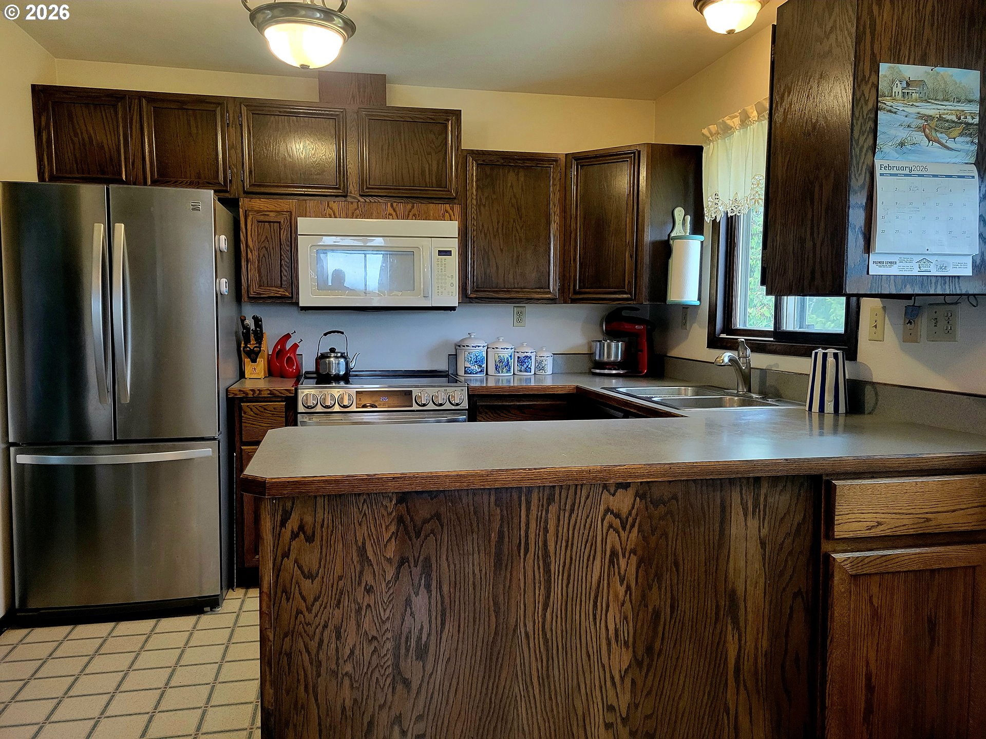 570 Drews Prairie Road Winlock, WA 98596 - Photo 22 of 41 a kitchen with kitchen island a counter top space cabinets and stainless steel appliances