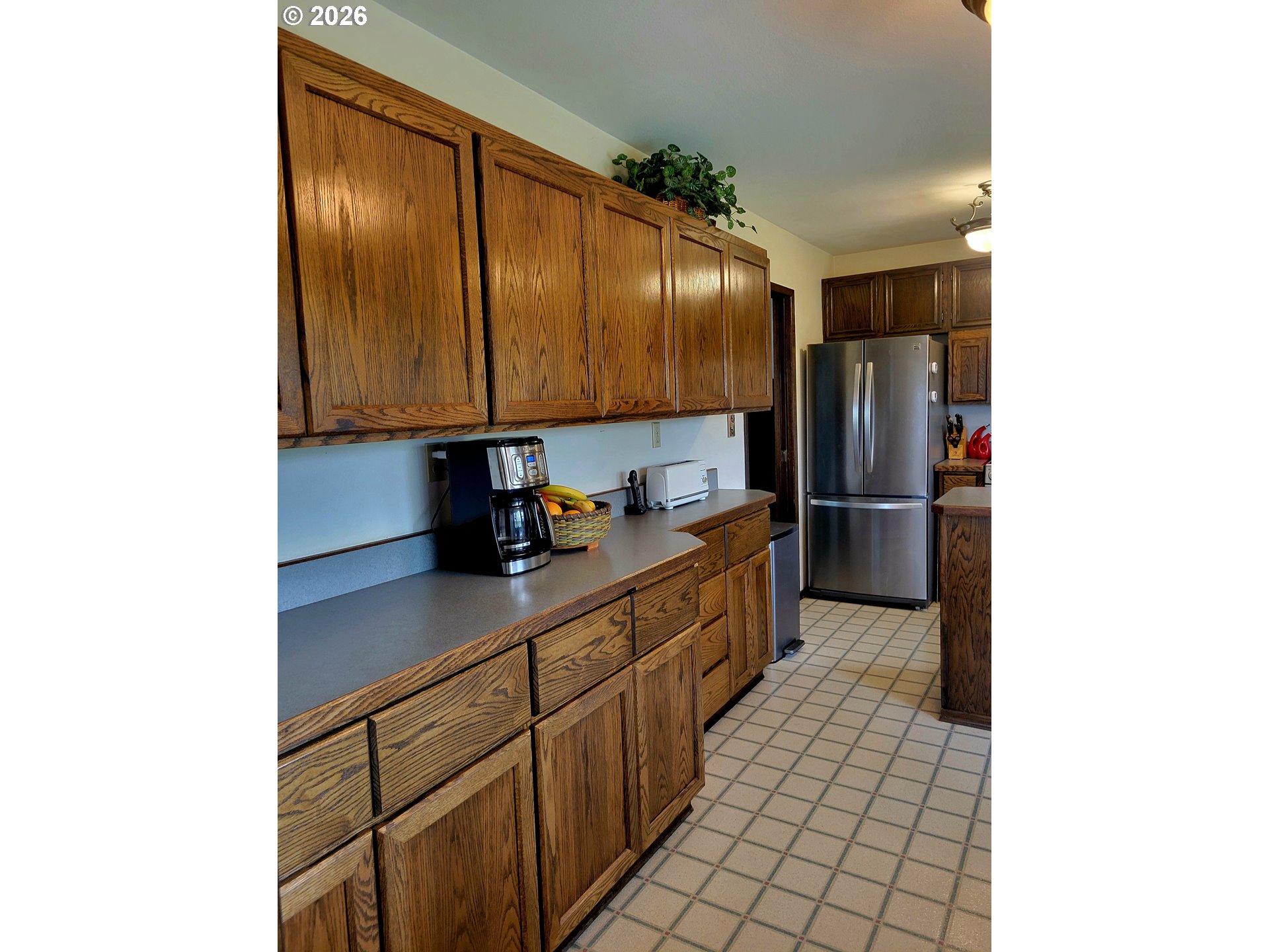 570 Drews Prairie Road Winlock, WA 98596 - Photo 24 of 41 a kitchen with stainless steel appliances a refrigerator and a sink