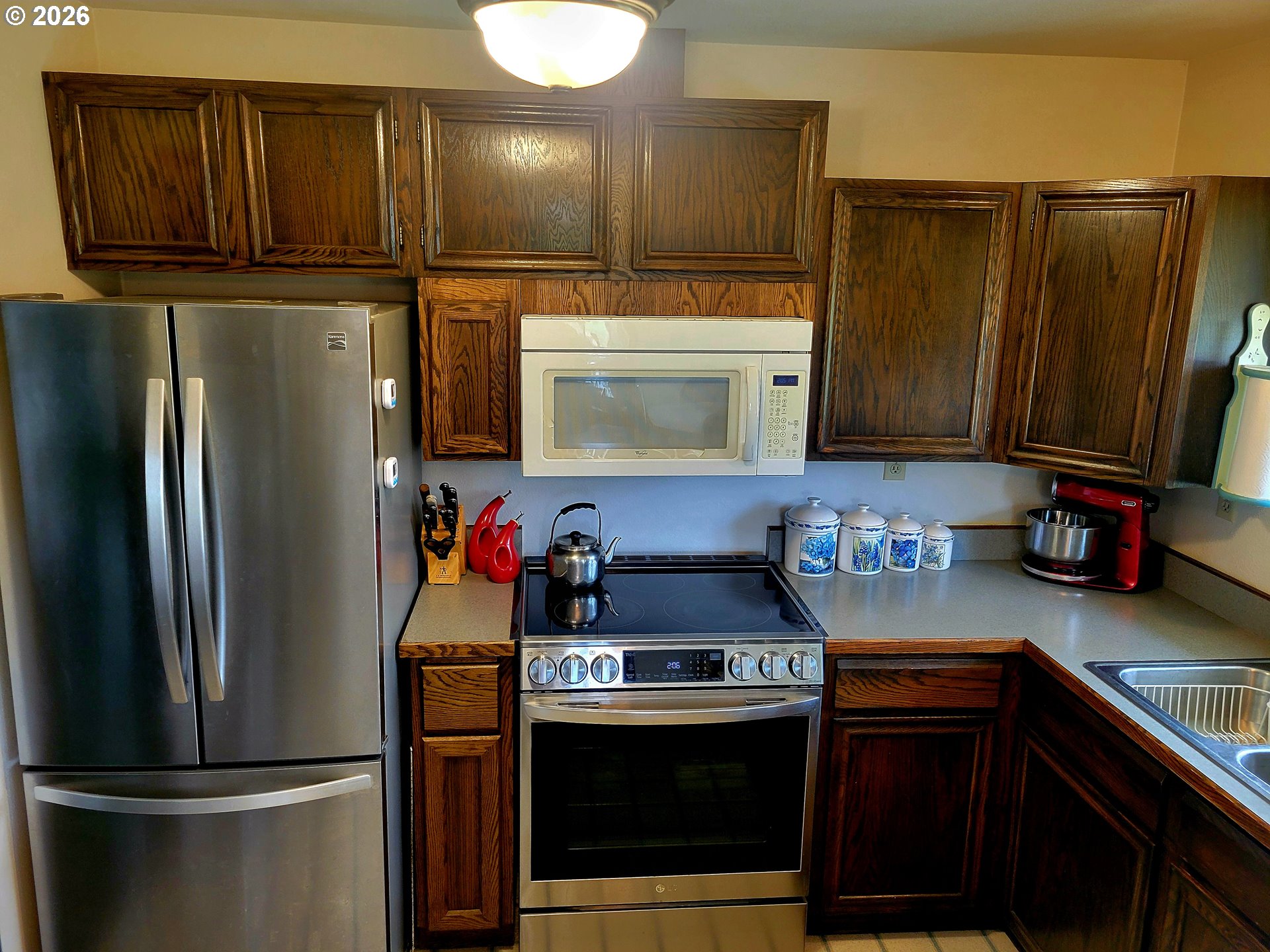 570 Drews Prairie Road Winlock, WA 98596 - Photo 25 of 41 a kitchen with stainless steel appliances granite countertop a refrigerator and a stove top oven