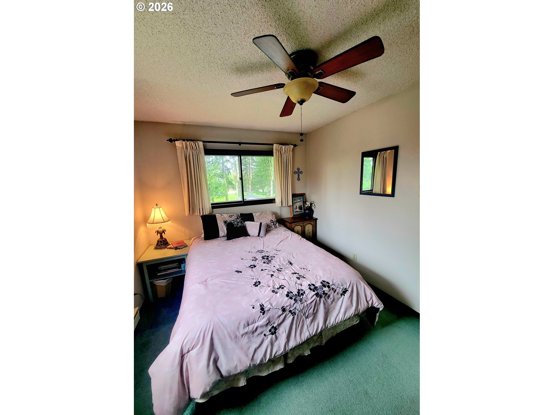 570 Drews Prairie Road Winlock, WA 98596 - Photo 30 of 41 a bedroom with a bed and a chandelier