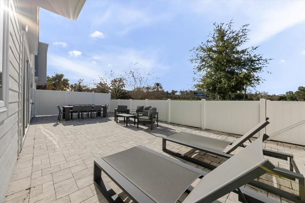 7770 Sandy Ridge Drive, Unit 144 Reunion, FL 34747 - Photo 11 of 22 a view of a terrace with furniture and a stove