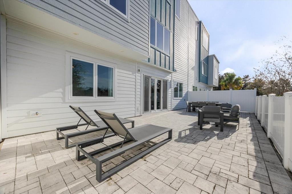 7770 Sandy Ridge Drive, Unit 144 Reunion, FL 34747 - Photo 12 of 22 a backyard of a house with seating space