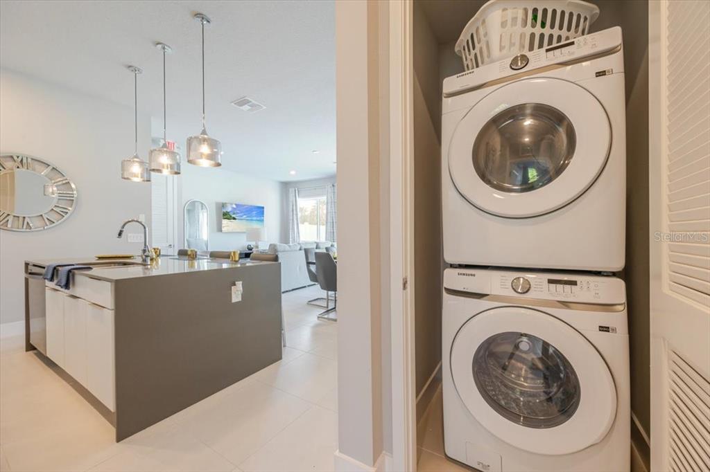 7770 Sandy Ridge Drive, Unit 144 Reunion, FL 34747 - Photo 22 of 22 a view of a kitchen with washer and dryer