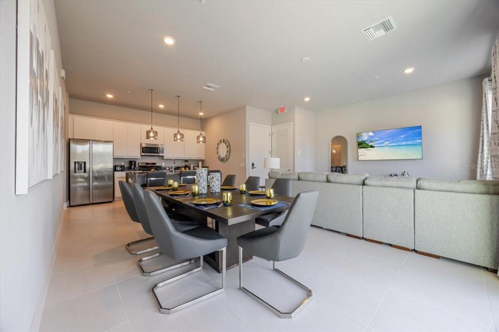 7770 Sandy Ridge Drive, Unit 144 Reunion, FL 34747 - Photo 6 of 22 a view of a dining room with furniture