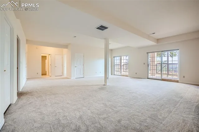 an empty room with windows