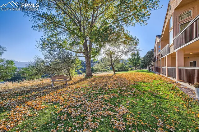 a view of a house with wooden fence