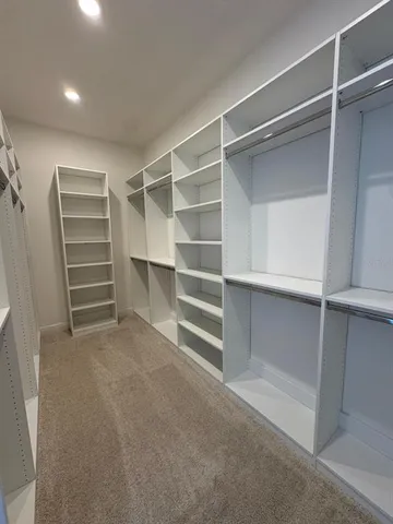 a view of an empty walk in closet