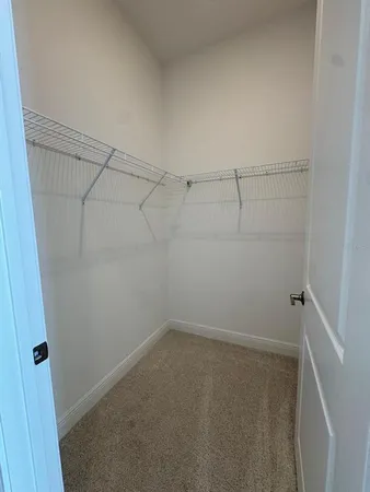 a view of a room with racks on the wall