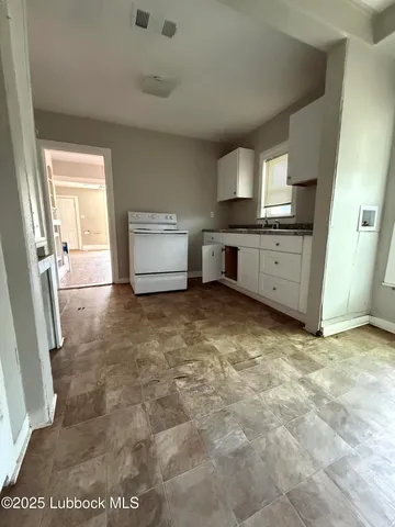 a view of a kitchen with a sink