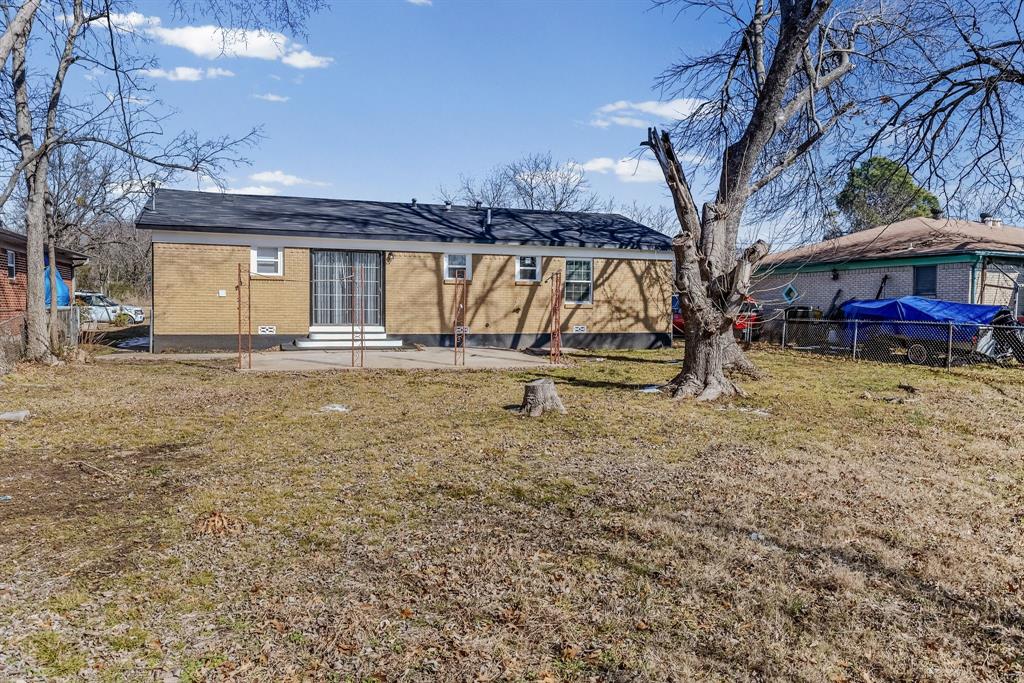 2117 Frazier Street Greenville, TX 75401 - Photo 22 of 25 a view of a house with a yard
