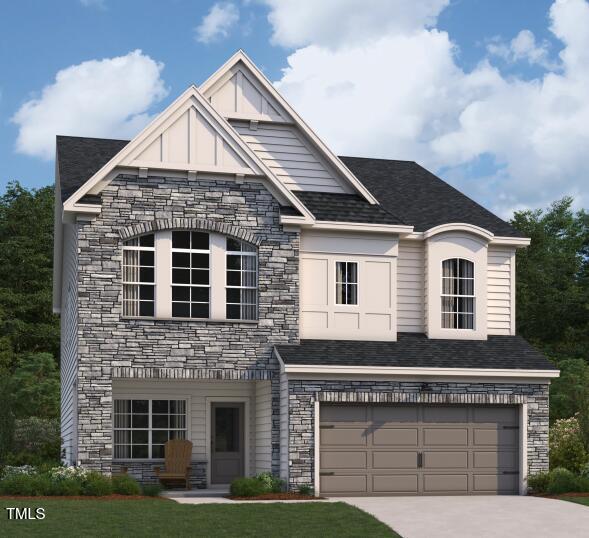 4311 Emeline Way, Unit 13 Fuquay-Varina, NC 27526 - Photo 1 of 3 a front view of a house with garden