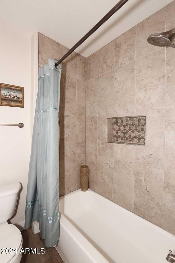 4925 East Desert Cove Avenue, Unit 363 Scottsdale, AZ 85254 - Photo 16 of 47 a bathroom with a toilet and a shower