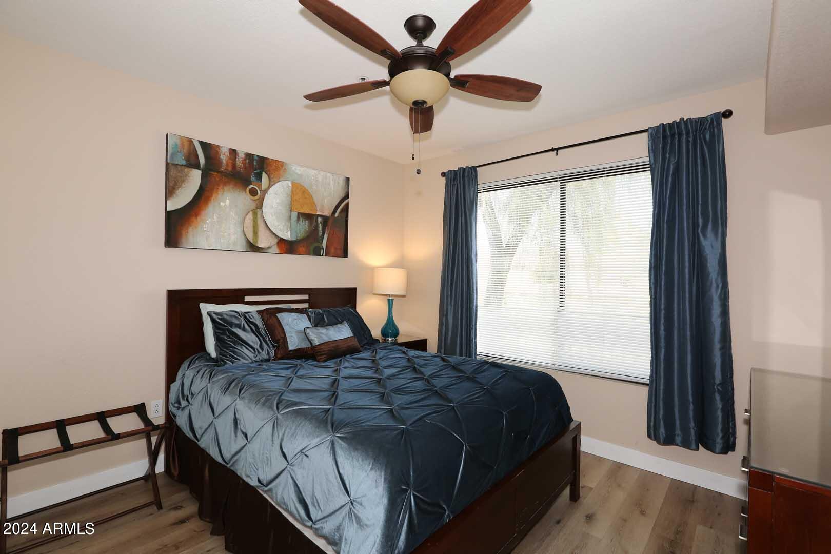 4925 East Desert Cove Avenue, Unit 363 Scottsdale, AZ 85254 - Photo 17 of 47 a bedroom with a bed and a window