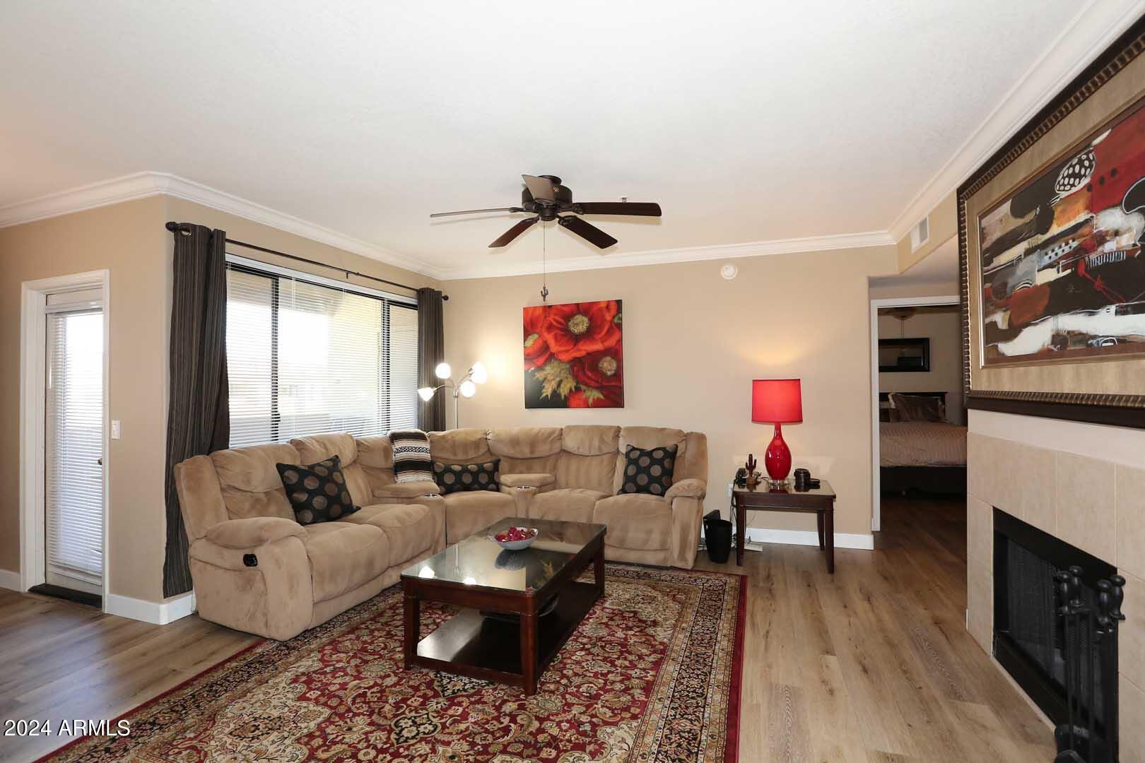4925 East Desert Cove Avenue, Unit 363 Scottsdale, AZ 85254 - Photo 2 of 47 a living room with furniture and wooden floor