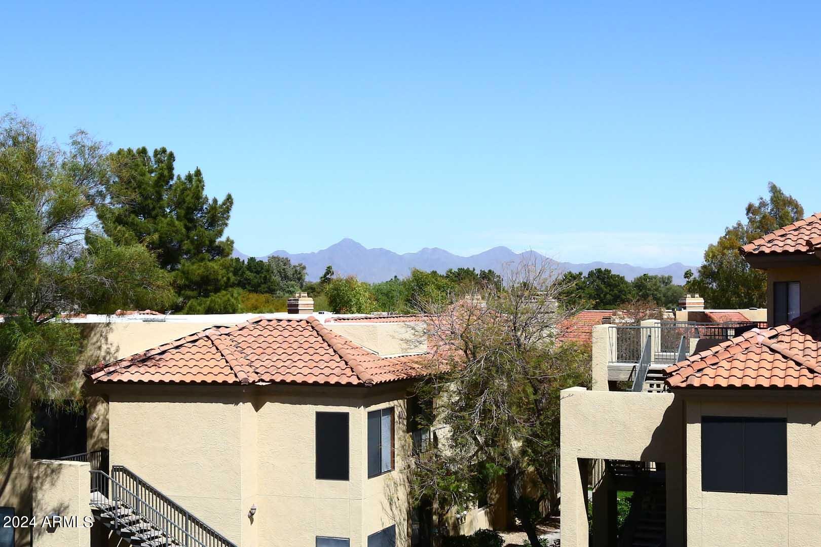 4925 East Desert Cove Avenue, Unit 363 Scottsdale, AZ 85254 - Photo 33 of 47 a view of a patio with a table and chairs