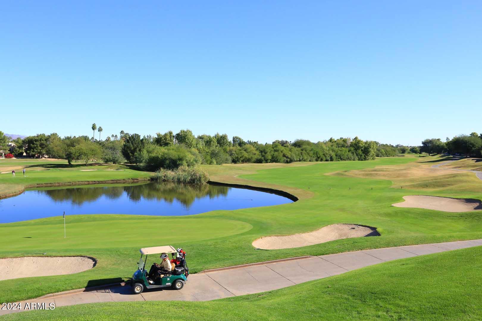 4925 East Desert Cove Avenue, Unit 363 Scottsdale, AZ 85254 - Photo 38 of 47 a view of a lake with houses in the back