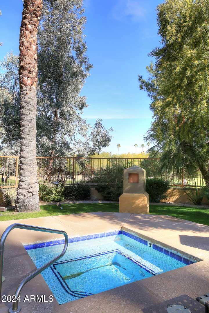 4925 East Desert Cove Avenue, Unit 363 Scottsdale, AZ 85254 - Photo 44 of 47 a view of swimming pool with outdoor seating and plants