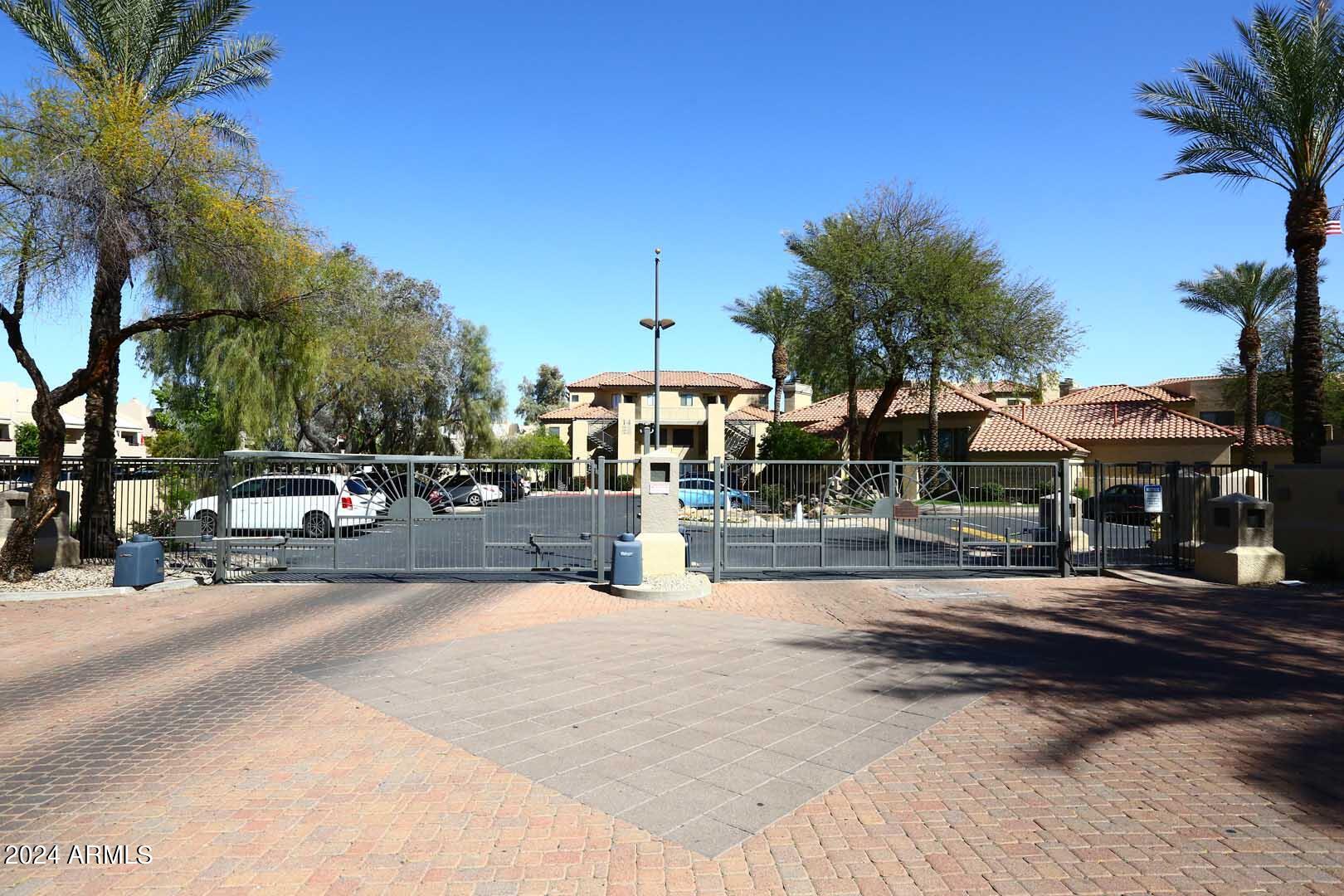 4925 East Desert Cove Avenue, Unit 363 Scottsdale, AZ 85254 - Photo 45 of 47 a view of a street with houses
