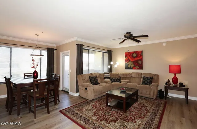 a living room with furniture and a large window