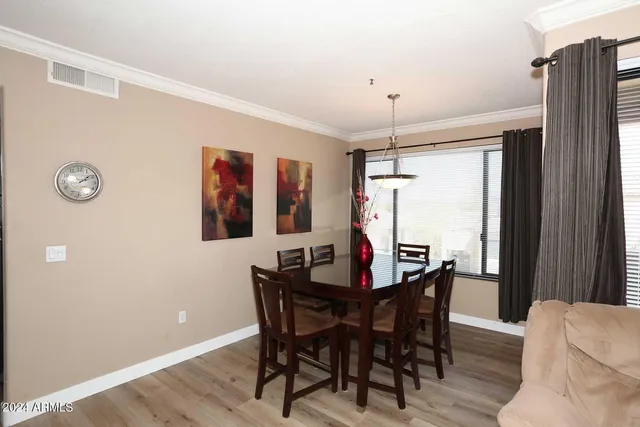 a view of a dining room with furniture and window