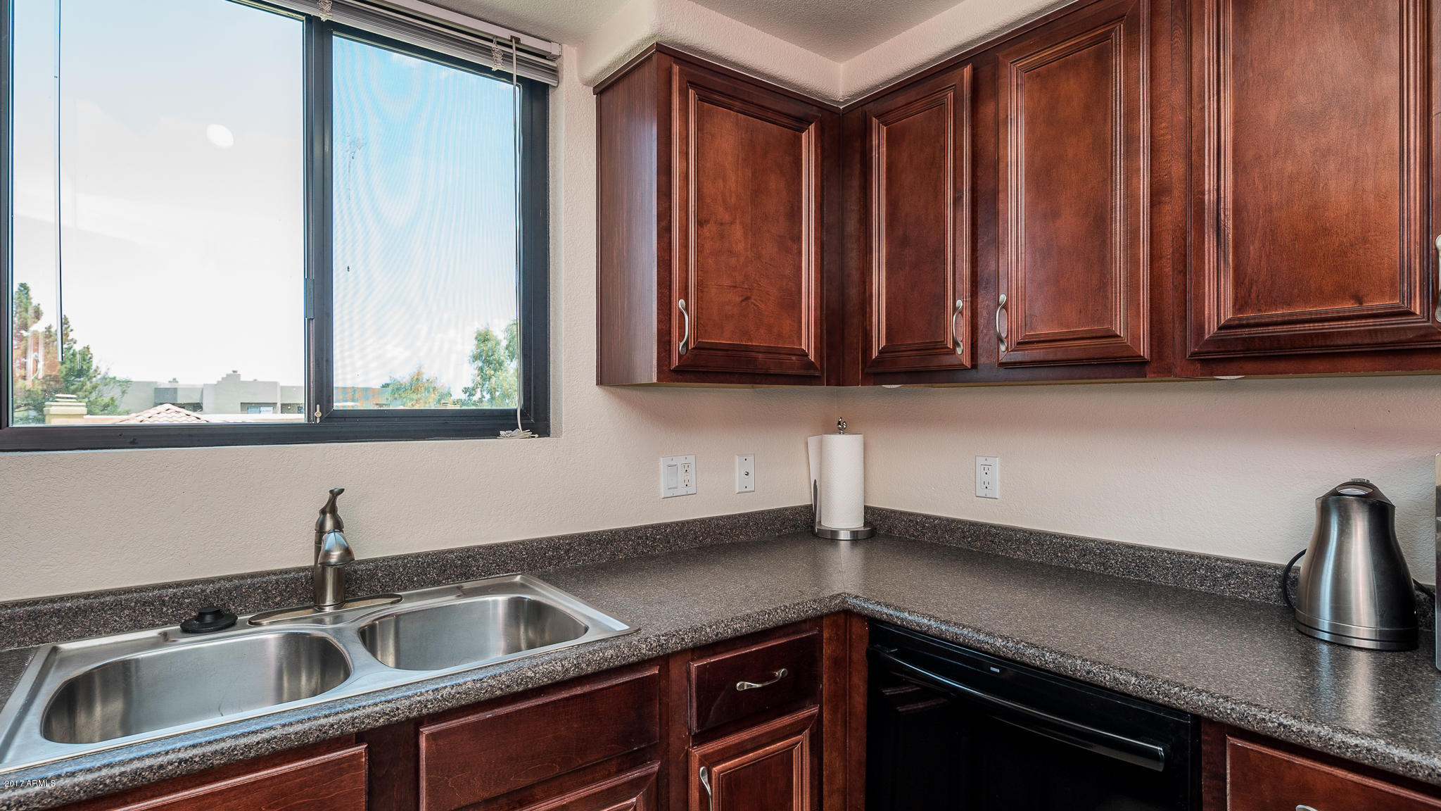 4925 East Desert Cove Avenue, Unit 363 Scottsdale, AZ 85254 - Photo 9 of 47 a kitchen with granite countertop a sink and a stove