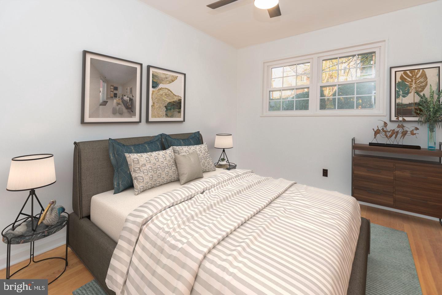 1323 Fernway Road Northwest Washington, DC 20012 - Photo 13 of 24 a bedroom with a bed and a lamp on dresser