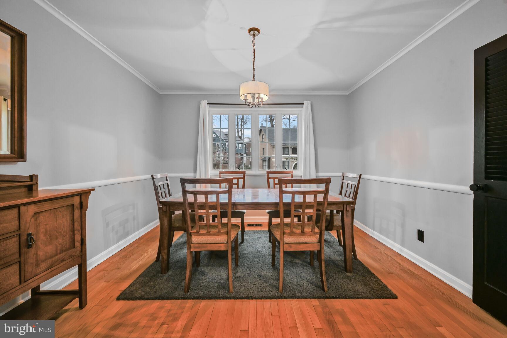 1323 Fernway Road Northwest Washington, DC 20012 - Photo 4 of 24 a view of a dining room with furniture window and wooden floor
