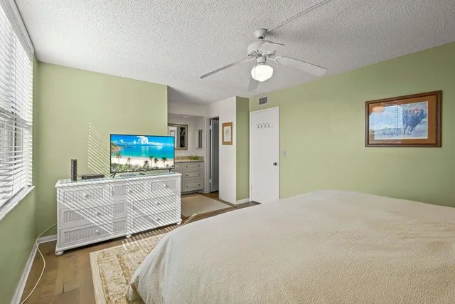 a bedroom with a bed and a table in it