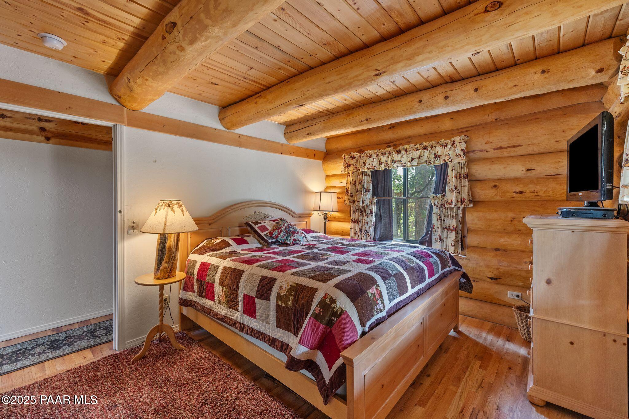 4575 East Combination Lane Prescott, AZ 86303 - Photo 15 of 50 a bedroom with a bed and wooden floor
