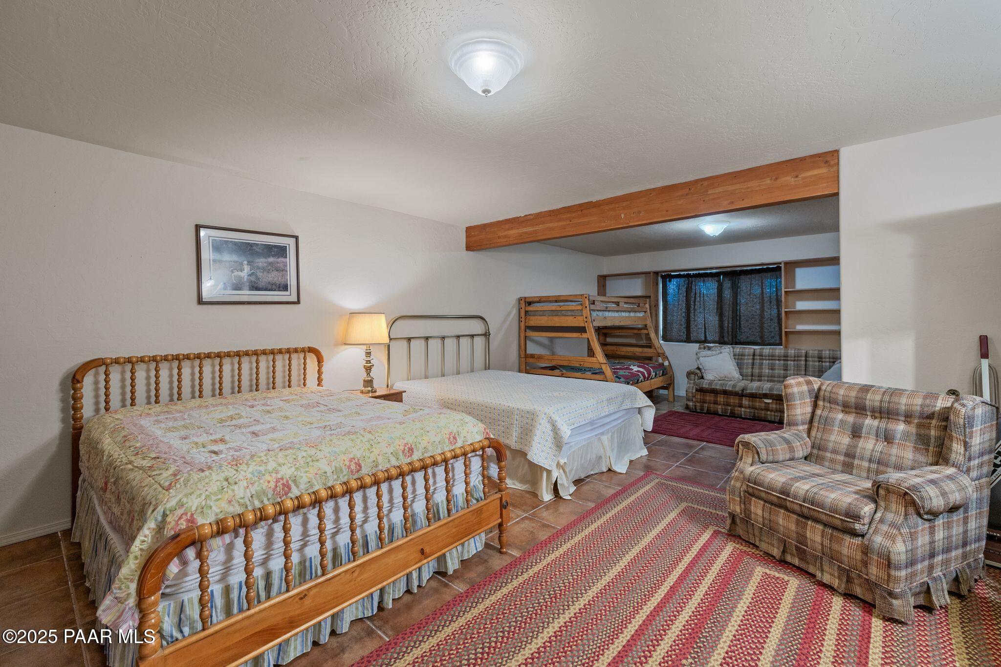 4575 East Combination Lane Prescott, AZ 86303 - Photo 22 of 50 a bedroom with a bed and a couch