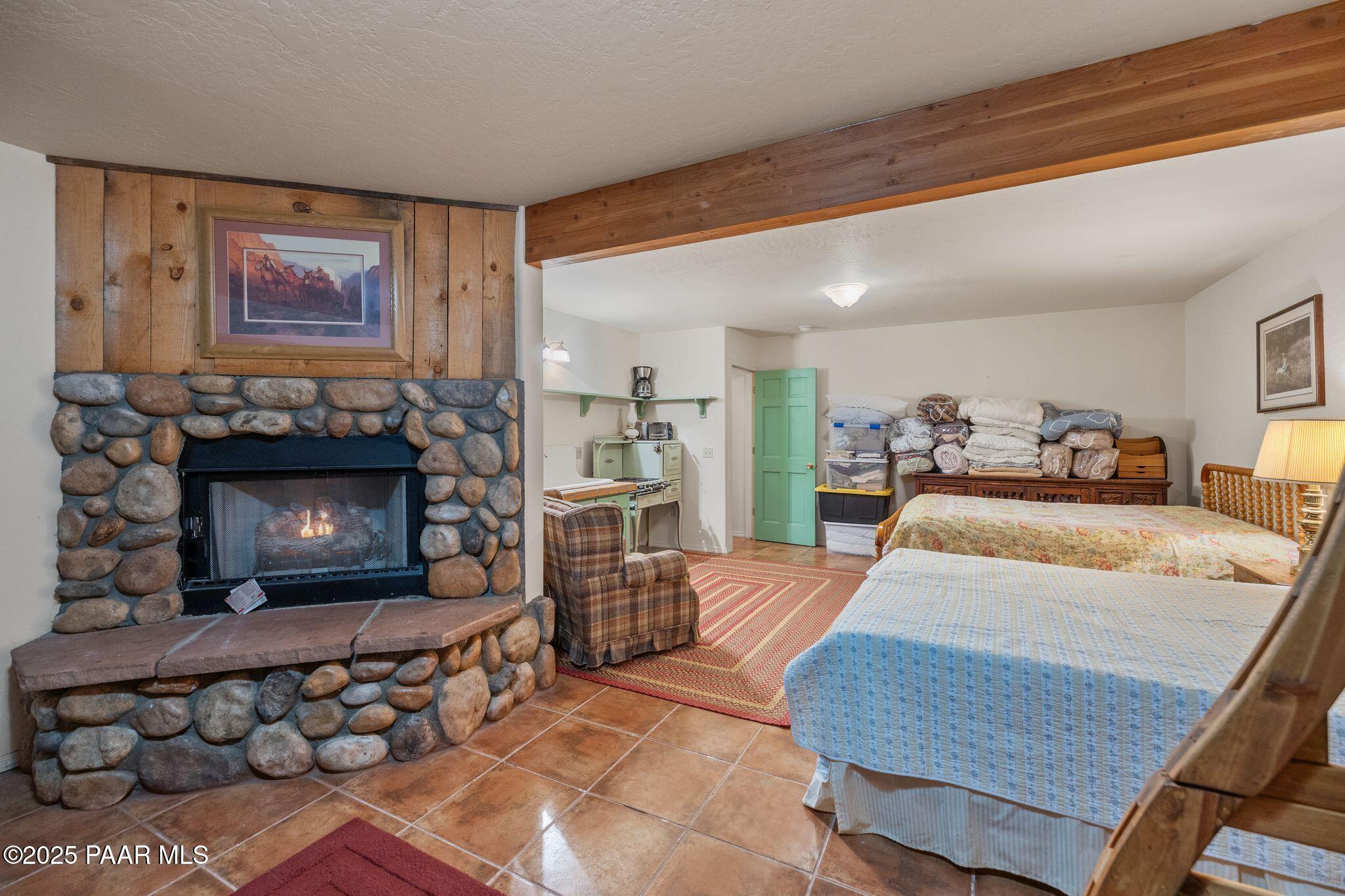 4575 East Combination Lane Prescott, AZ 86303 - Photo 24 of 50 a bed room with a bed and a fireplace