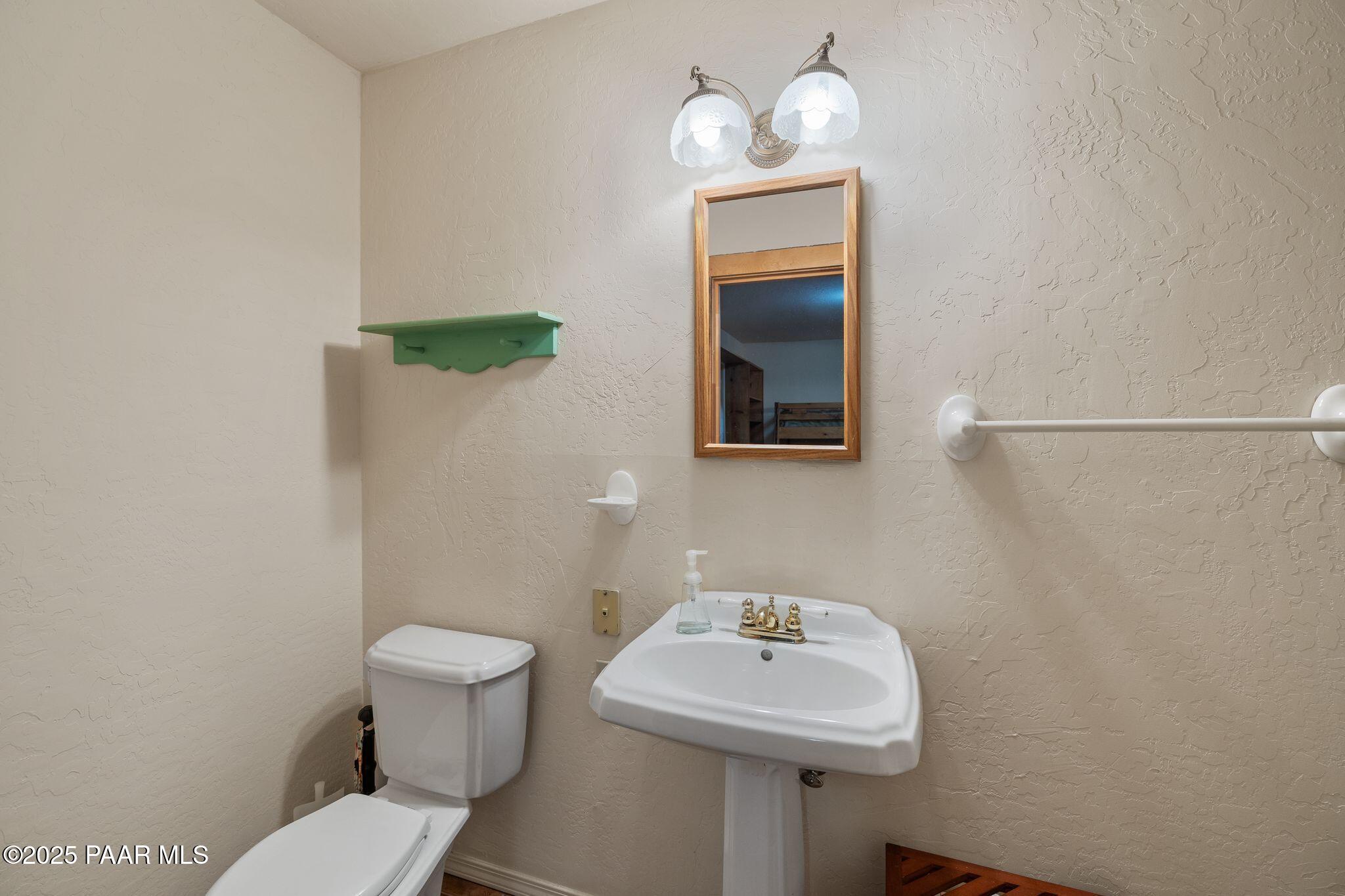 4575 East Combination Lane Prescott, AZ 86303 - Photo 25 of 50 a bathroom with a sink a toilet and mirror