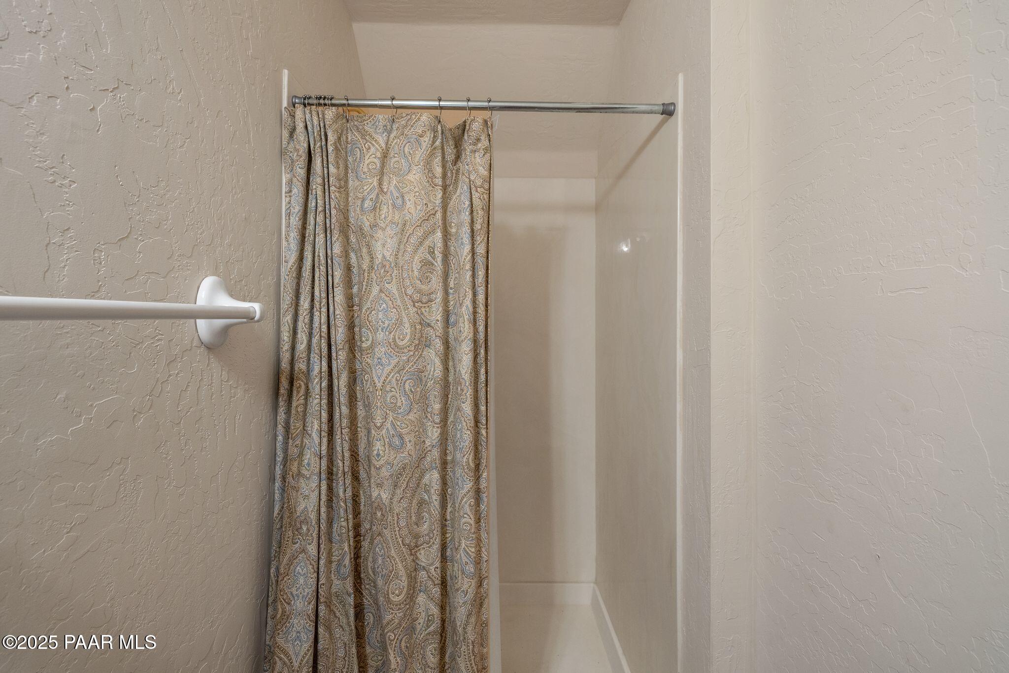 4575 East Combination Lane Prescott, AZ 86303 - Photo 26 of 50 a bathroom with a shower and a curtain