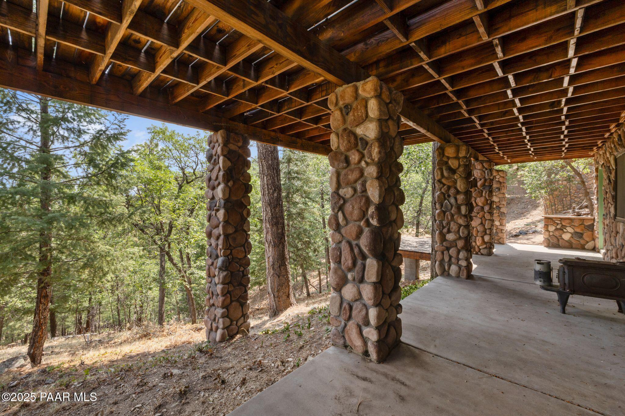 4575 East Combination Lane Prescott, AZ 86303 - Photo 35 of 50 a porch with trees in front of it