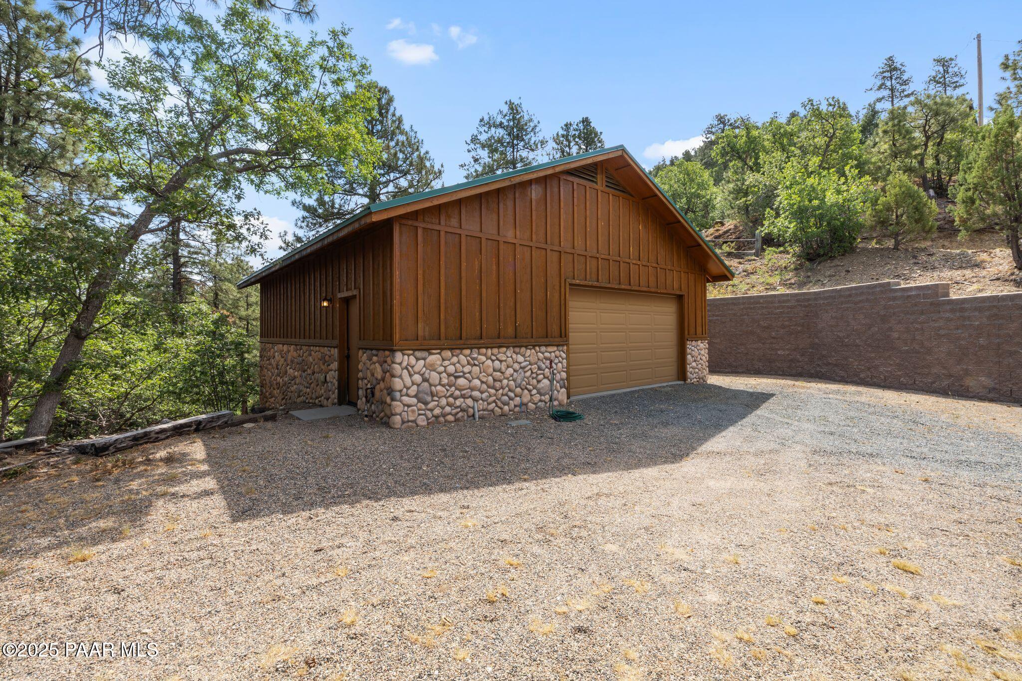4575 East Combination Lane Prescott, AZ 86303 - Photo 36 of 50 a view of a small house with a yard and garage