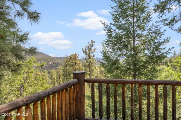 a view of a balcony with wooden fence