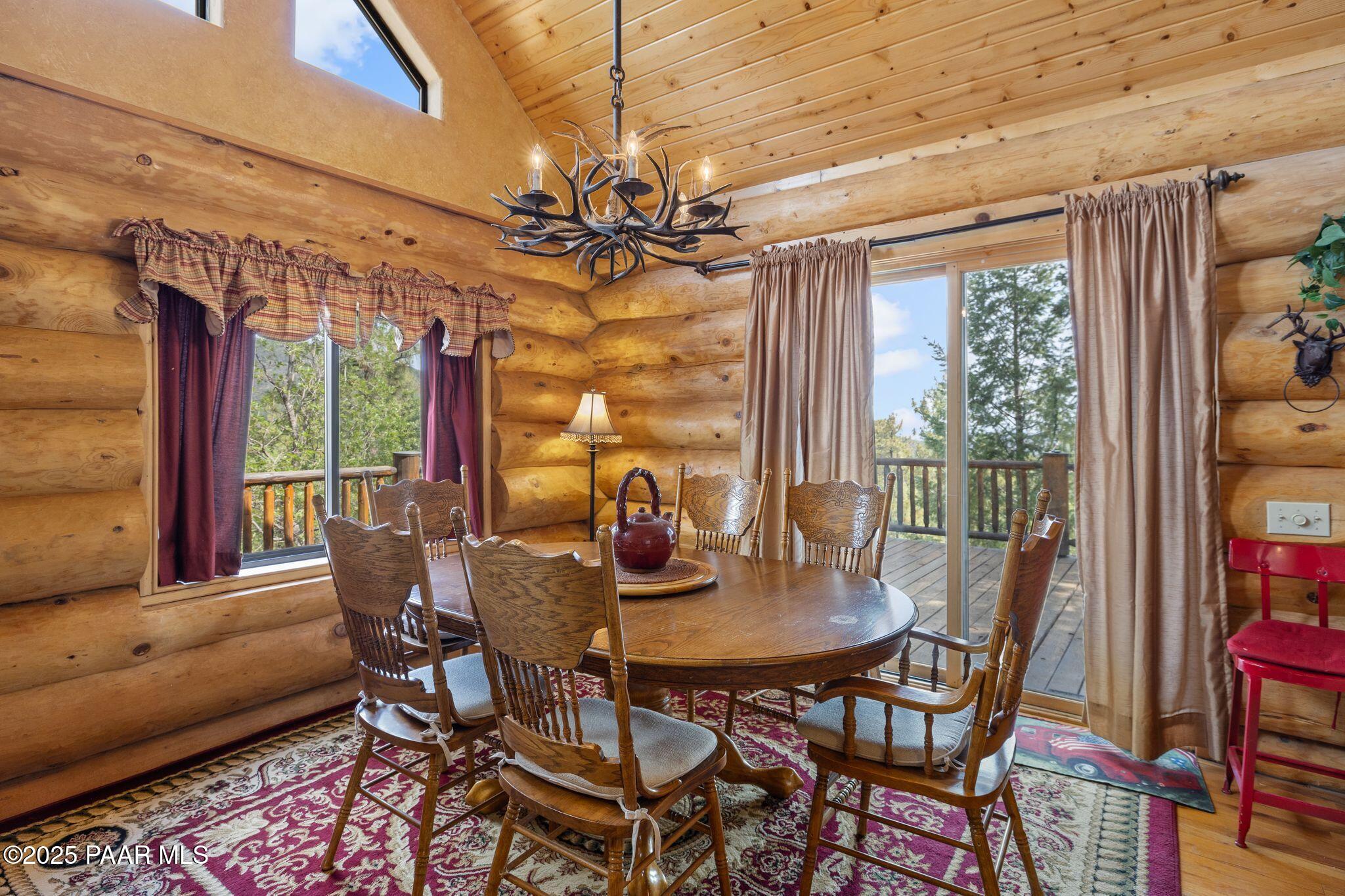 4575 East Combination Lane Prescott, AZ 86303 - Photo 9 of 50 a view of a dining room with furniture wooden floor and chandelier