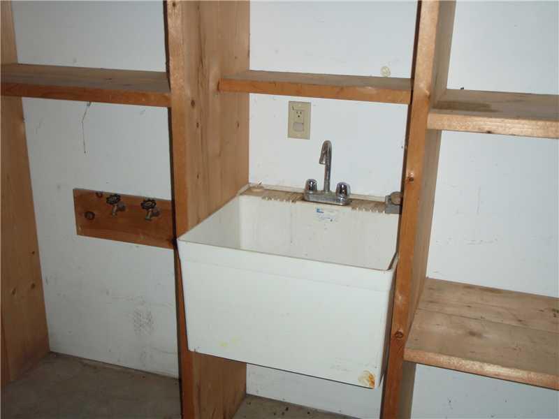 26 Rabbit Run Wiscasset, ME 04578 - Photo 25 of 29 Other. Utility sink in garage with...