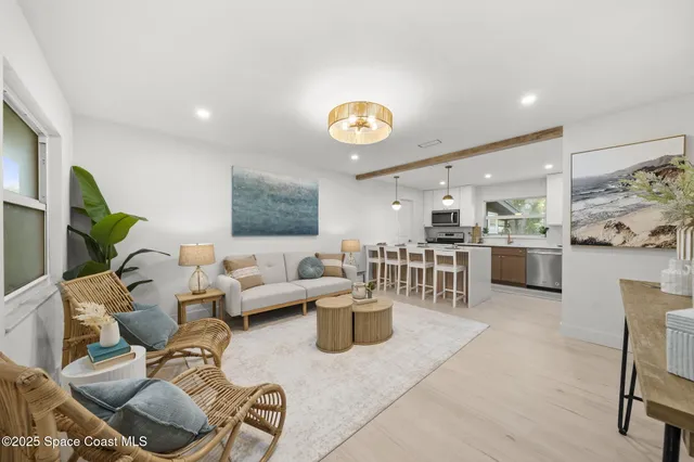 a living room with furniture and a clock