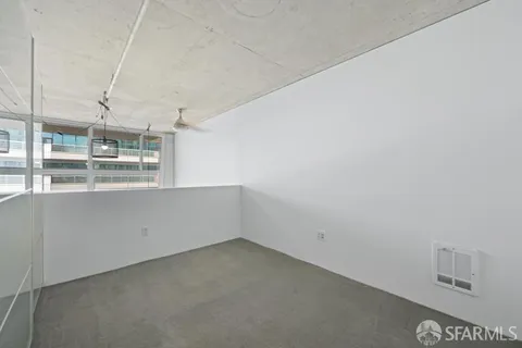a view of a kitchen with wooden floor